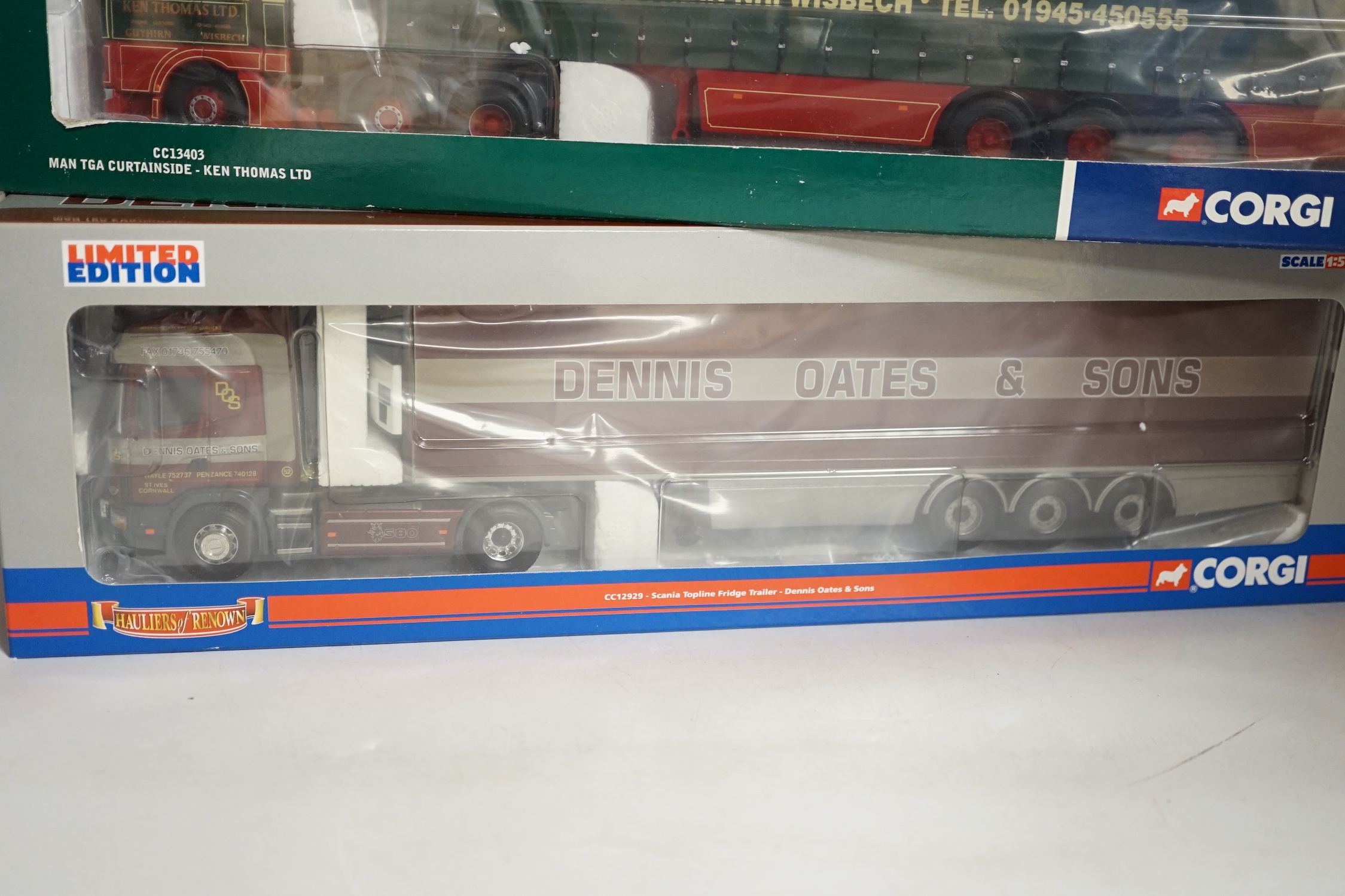 Four boxed Corgi 1:50 scale articulated trucks; a DAF XF Space Cab Curtainside lorry (CC13227), a MAN TGA curtainside lorry (CC13403), a Scania Topline with Fridge Trailer (CC12929) and a Volvo F88 Tautliner curtainside